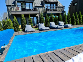 Jaukūs apartamentai su baseinu ir gultais